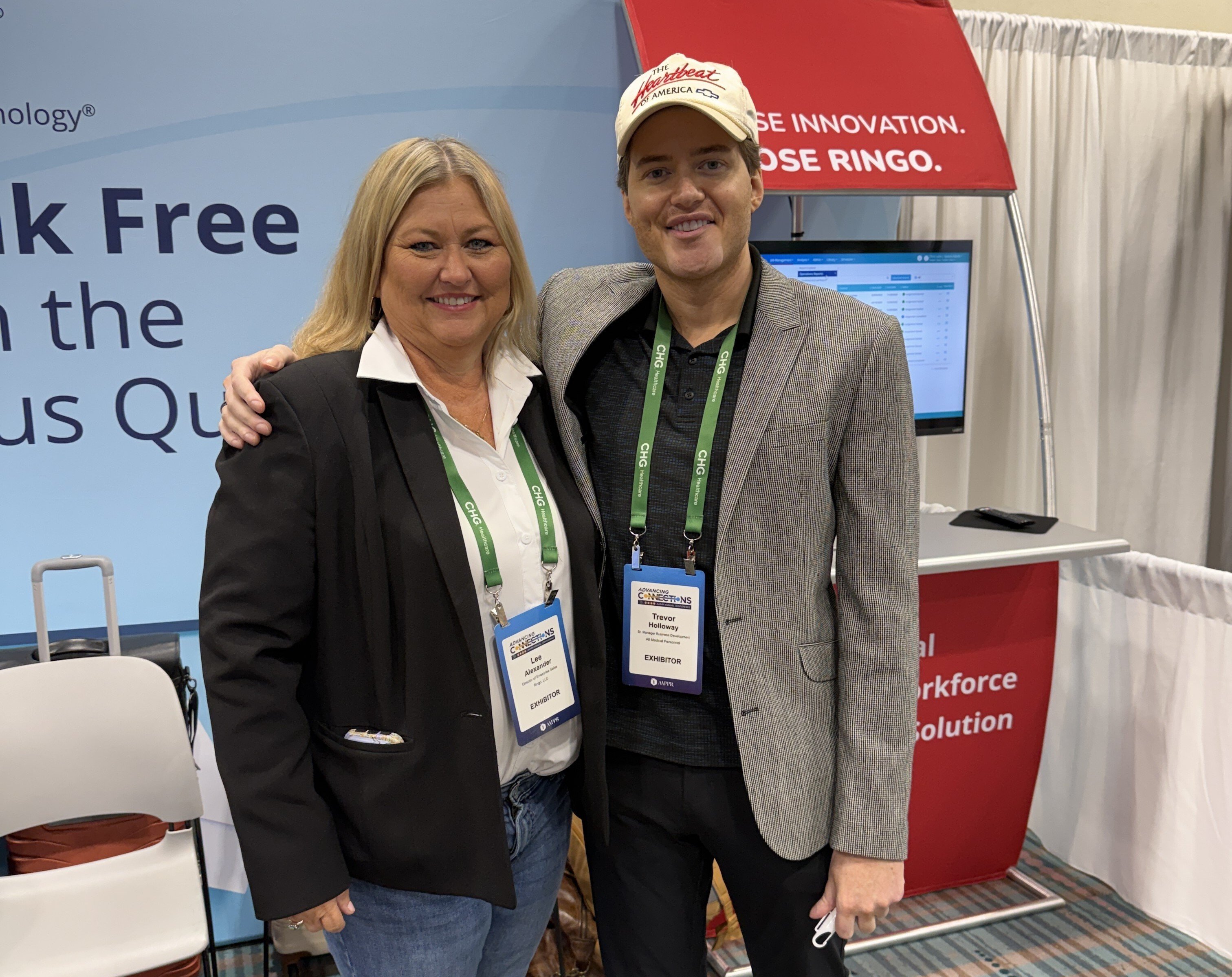 Healthcare professionals at Ringo booth during AAPPR conference, discussing vendor-neutral workforce management solutions.