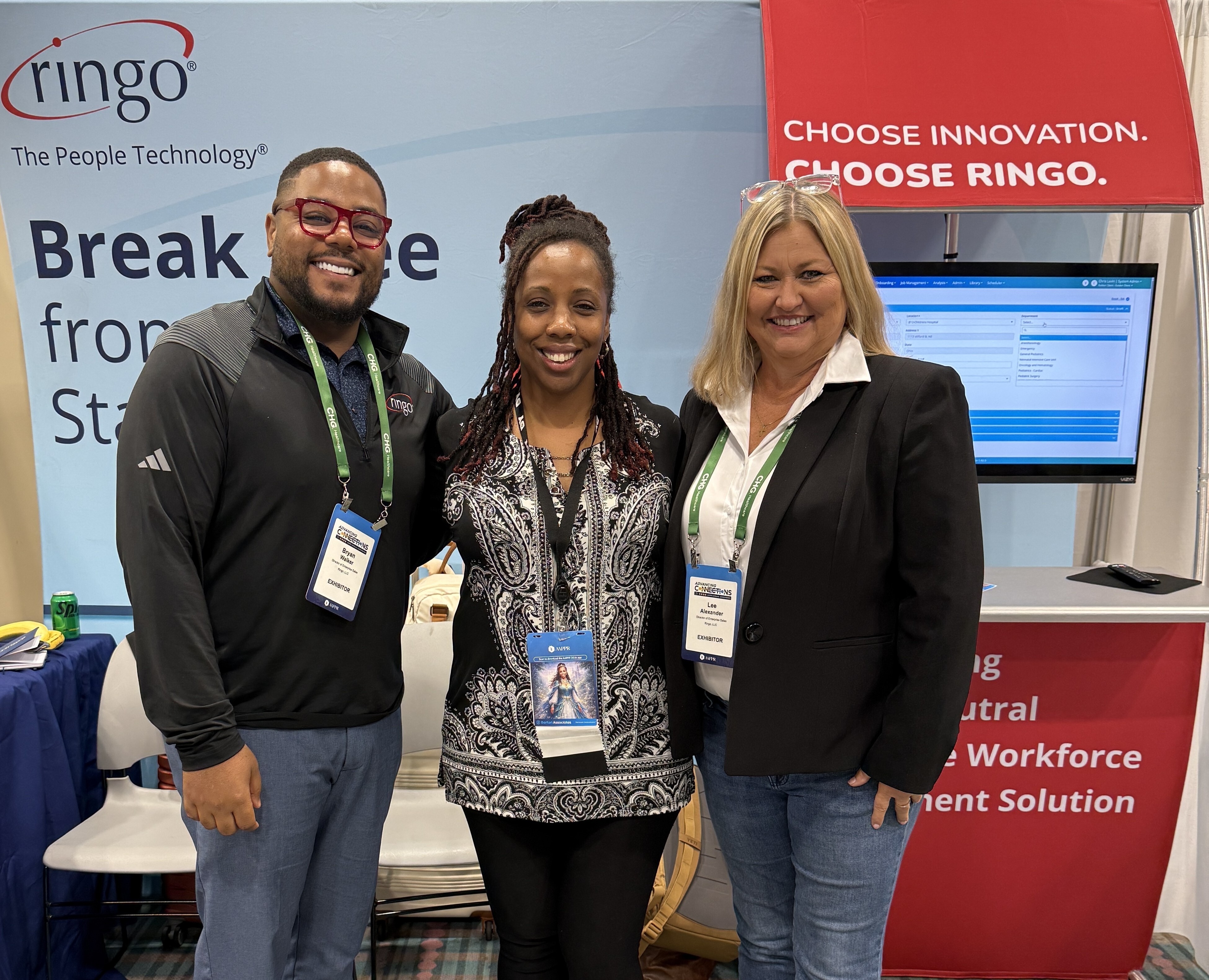 Healthcare professionals at Ringo booth during AAPPR conference, engaging with vendor-neutral workforce management technology solutions.