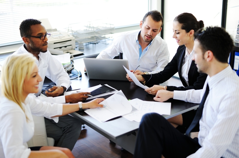 Business people working in office having meeting.jpeg Business people working in office having meeting.jpeg