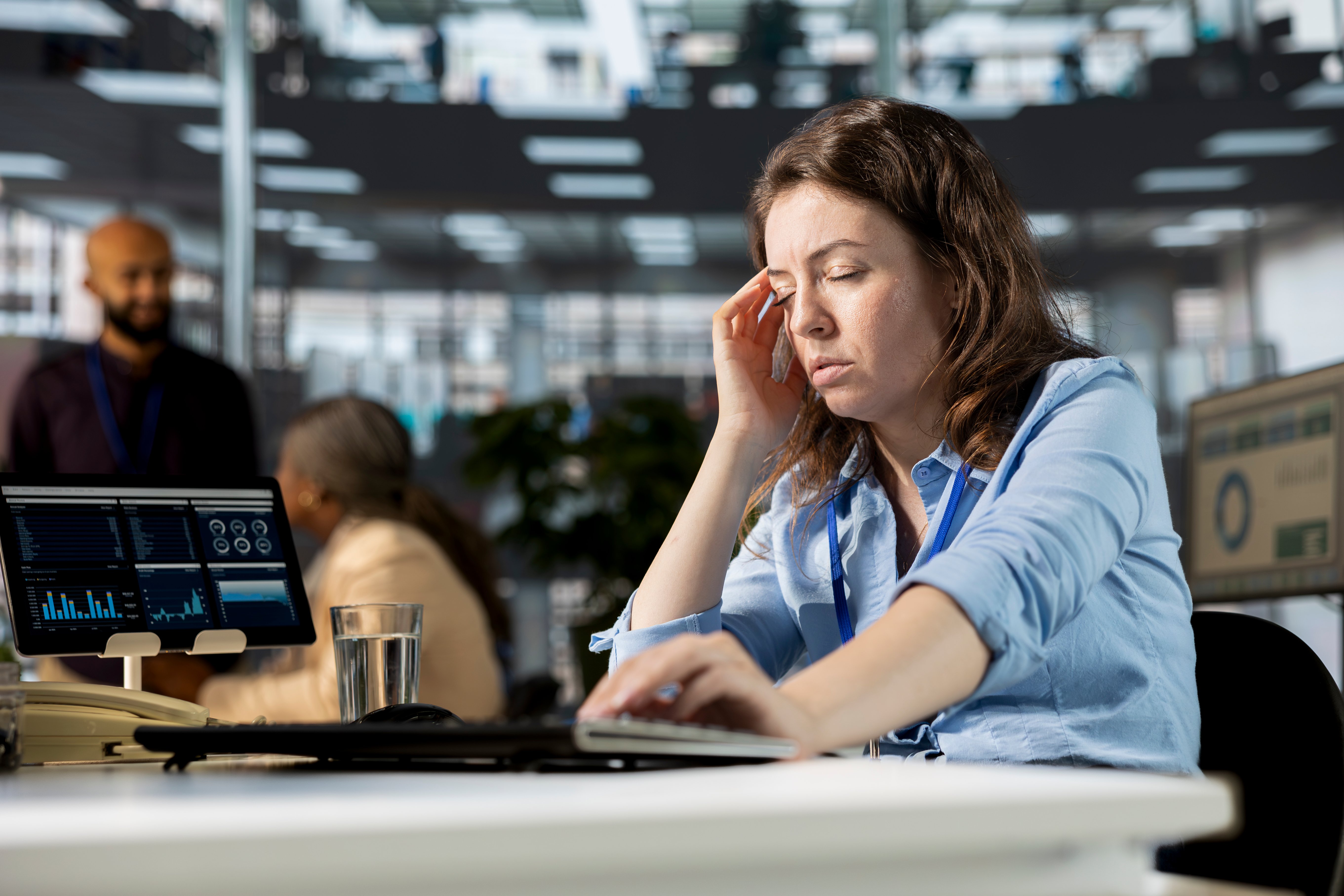 Healthcare staff employee burned out working on a computer